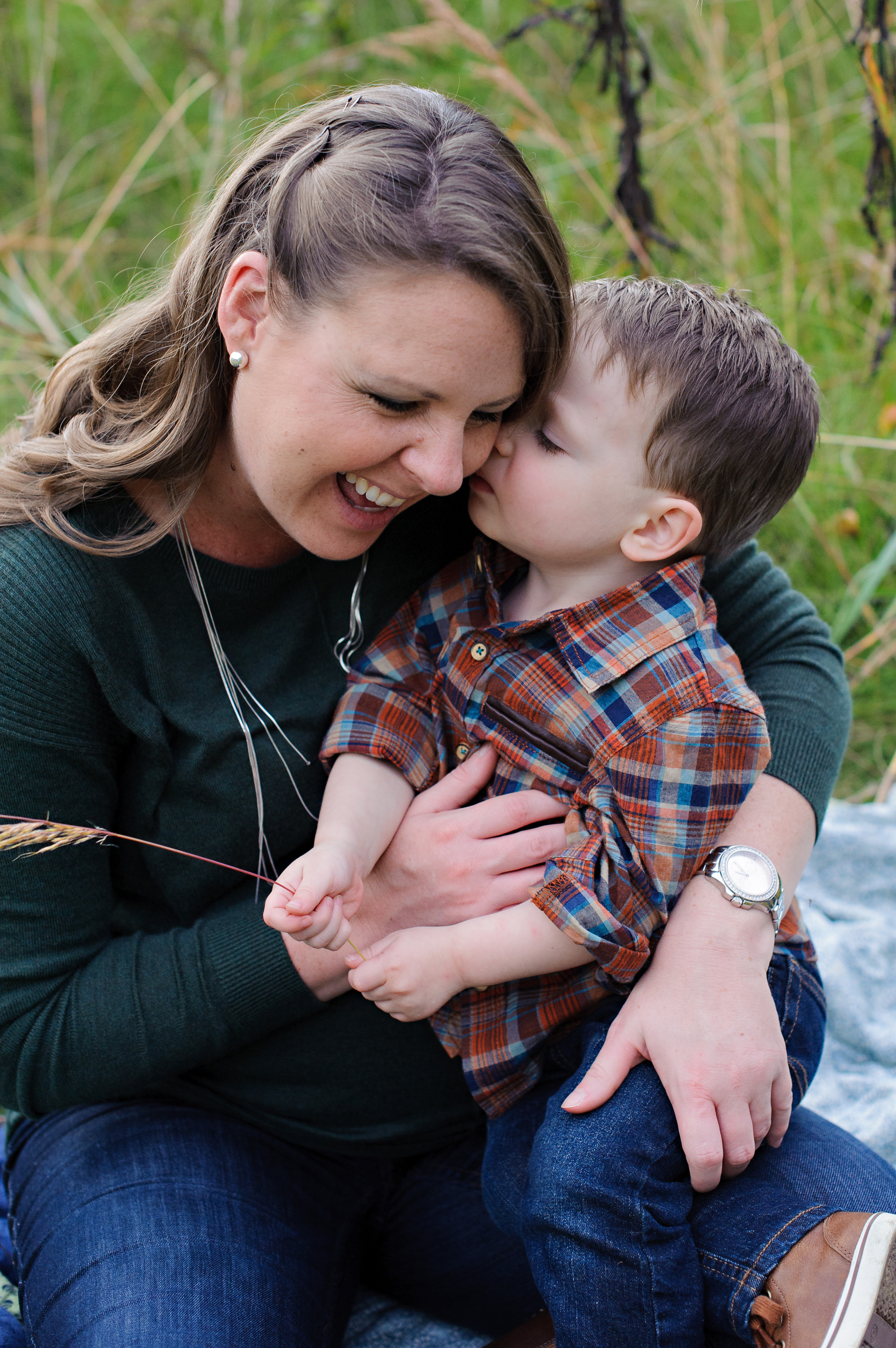 Mother with Skin Cancer snuggles her toddler son