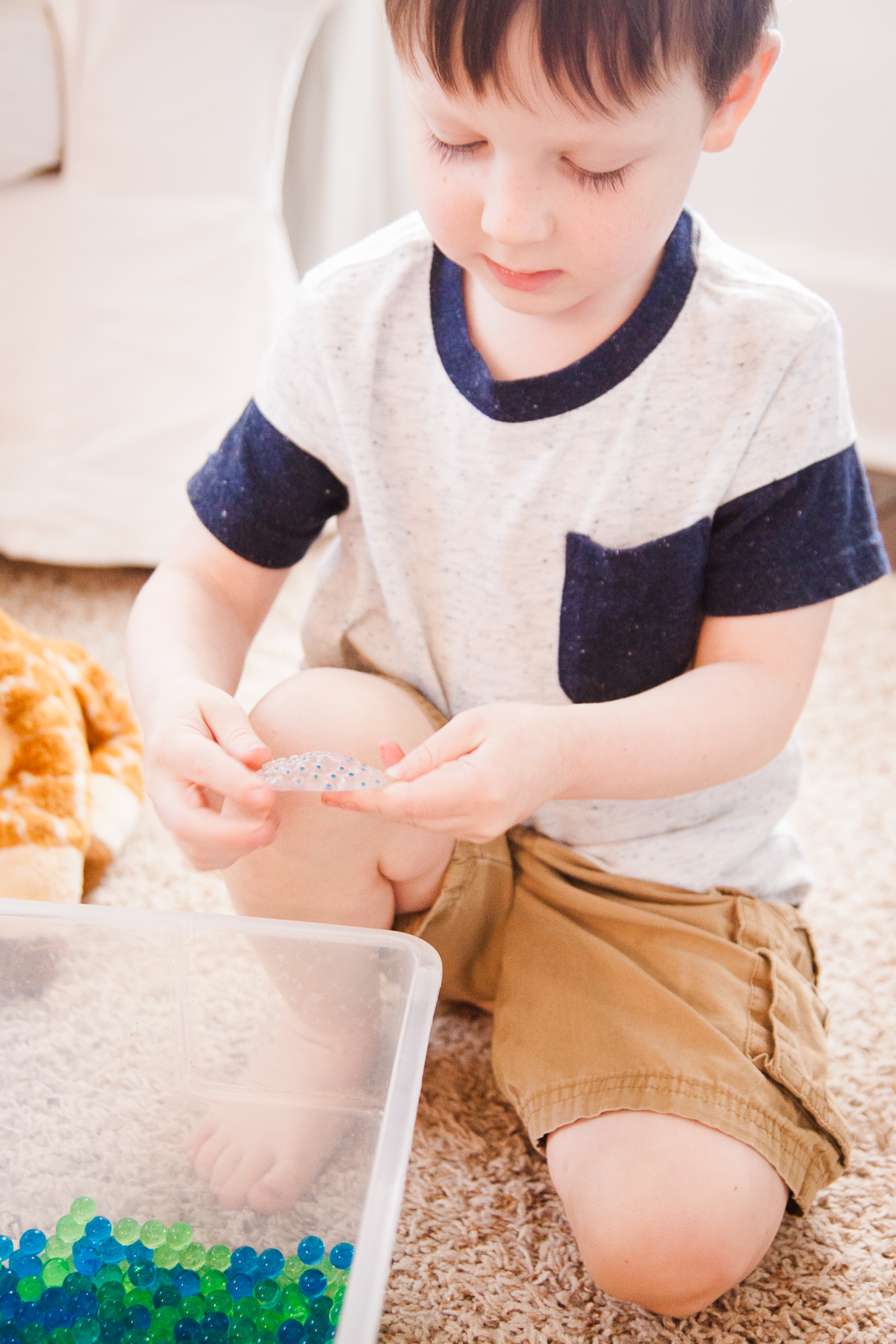 Preschooler Explors the Life Cycle of a Frog in A Year of Playing Skillfully